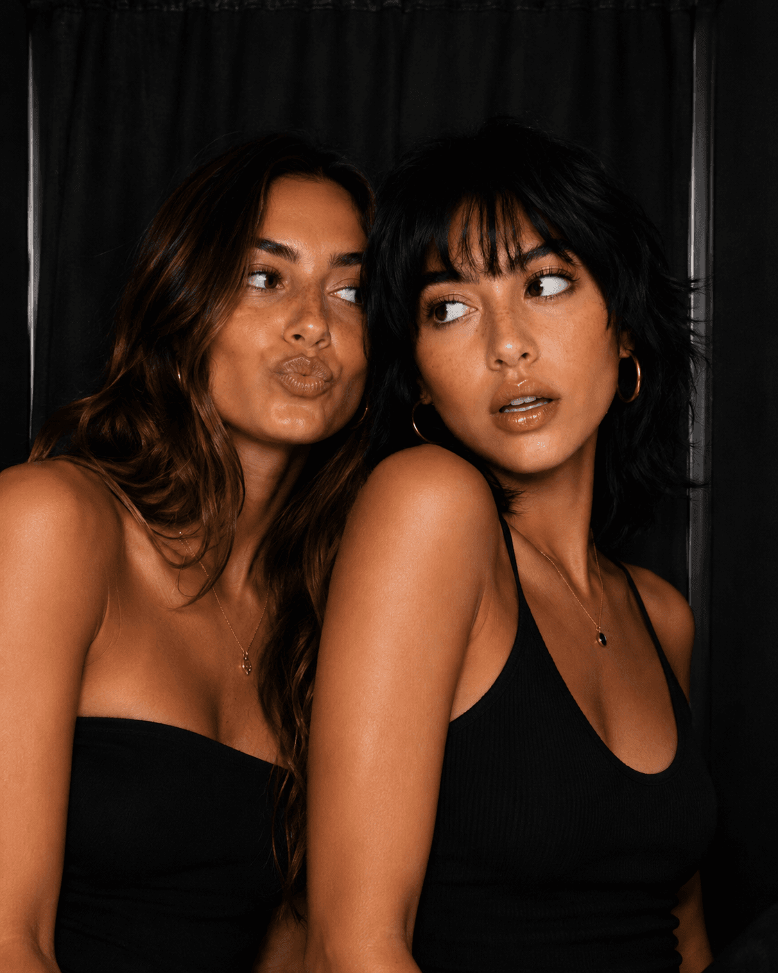 Guests photographed inside a Le Booth photo booth
